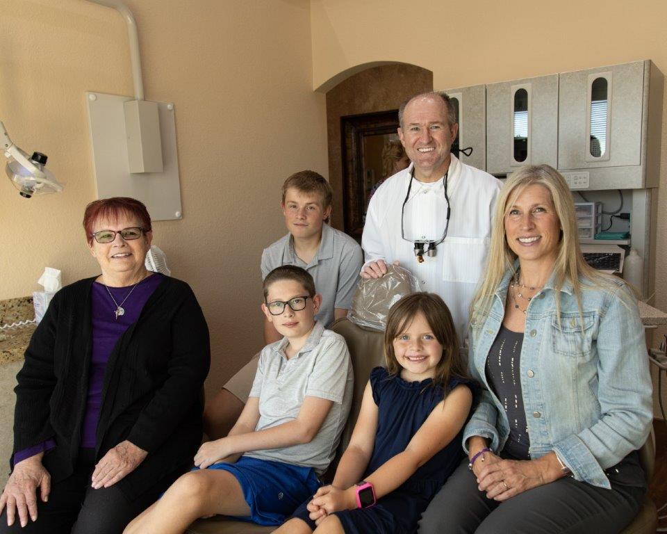 Doctor Gerry with family of patients